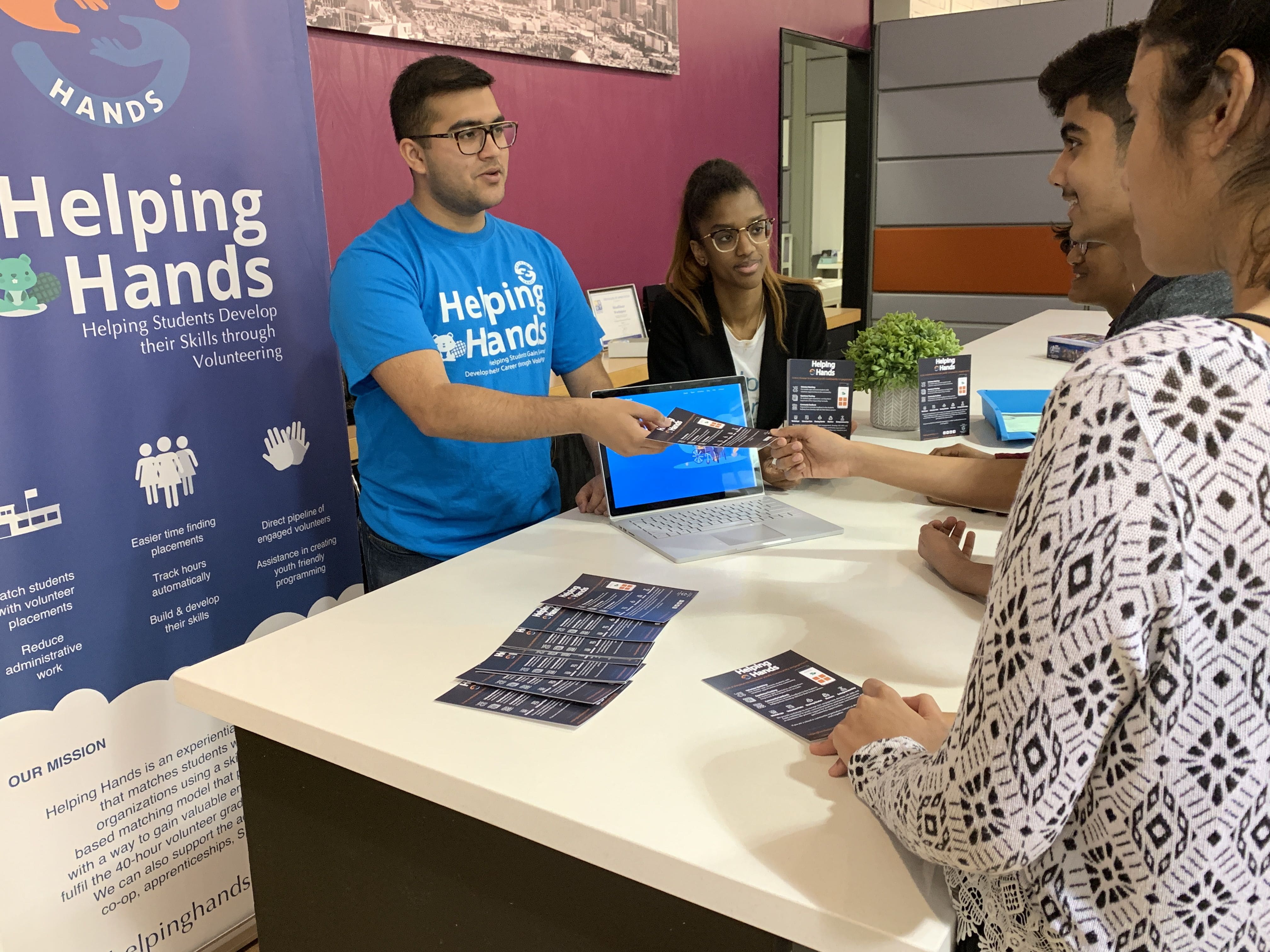 Volunteer Fair Booth with Students